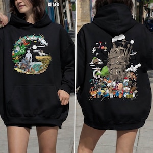 May include: Black hoodie featuring a front graphic of a dragon and characters in a circular design. The back displays a large graphic of a castle and animated characters. The word "BLACK" is printed at the top.
