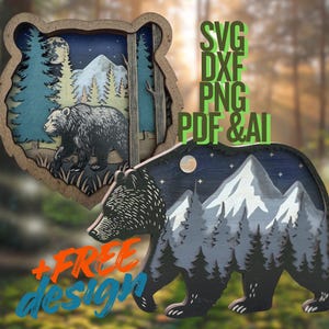 May include: Wooden bear-shaped art pieces depicting a forest and mountain scene. One is a layered design with a bear, trees, and a moon. The other is a bear silhouette with a mountain and forest design. The image also includes text that says "SVG DXF PNG PDF & AI".