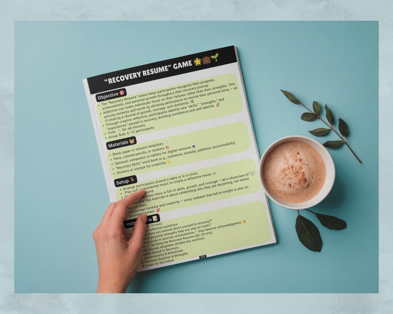 May include: A printed document titled "RECOVERY RESUME" GAME with sections for Objective, Materials, Setup, and Instructions. The page features light green text boxes on a white background, accented with small icons and emojis.