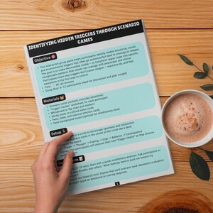 May include: A printed document titled Identifying Hidden Triggers Through Scenario Games with sections for Objective, Materials, Setup, and Instructions. The page features light blue text boxes on a white background with black headers.
