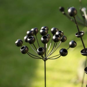Rustic Metal Flower Garden Stake: Handmade Exotic Bloom.
