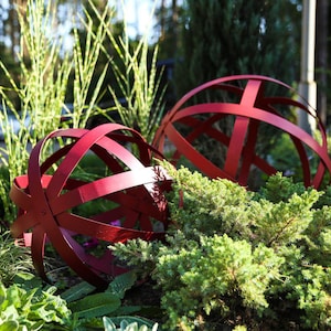 Rustic Metal Sphere Garden Art: Statement Piece for Your Outdoor Oasis.