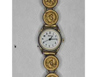 Raro reloj vintage Legacy en tono dorado, de oficial de la marina, con correa de botón CPO, requiere batería.