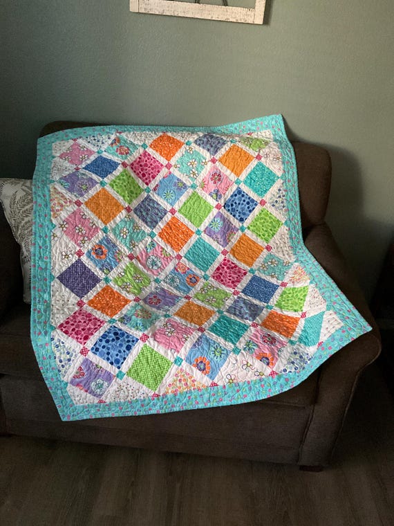 Fun, colorful crib sized baby quilt.