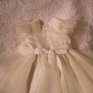 flutter sleeves silk organza baptismal gown with satin buttons and sash