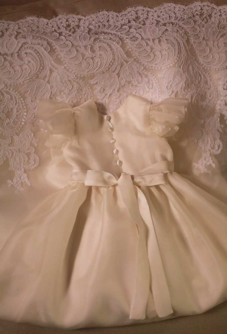 flutter sleeves silk organza baptismal gown with satin buttons and sash