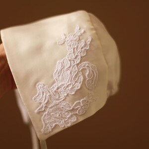 Matching silk and white lace bonnet with handmade Christening gown