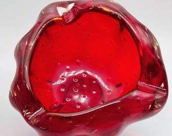 A striking vintage mid century Murano bullicante ashtray in blood red