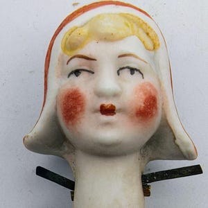 A antique bisque hand painted Victorian porcelain figure 'Nodder' head of lady in traditional bonnet