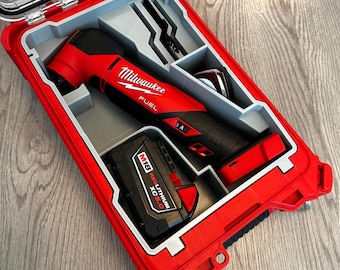 May include: A red and black Milwaukee FUEL multi-tool kit in a red hard case. The kit includes the multi-tool, a battery, and several attachments. The case is open, revealing the tools and accessories.