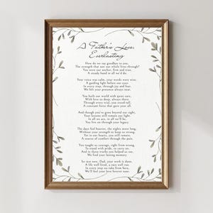 May include: A framed print with a brown wooden frame. The print features a poem titled "A Father's Love, Everlasting" in a delicate, handwritten-style font. The poem is surrounded by a watercolor-style floral border.