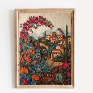 May include: Framed artwork depicting a vibrant desert landscape with a village, cacti, and colorful flowers. A red bird perches on a cactus. The artwork features a variety of colors, including red, orange, green, and blue.