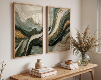 May include: Two framed abstract art pieces with a textured, layered design. The artwork features shades of green, gold, and cream, with a natural wood frame. The pieces are mounted on a white wall, creating a modern aesthetic.