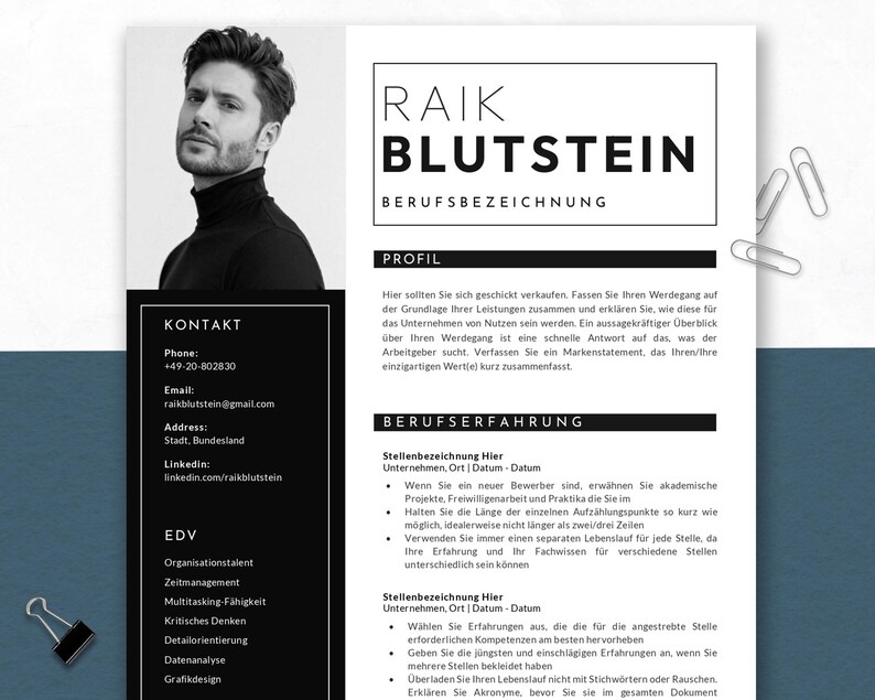 May include: A black and white resume template featuring a headshot of a man in a black turtleneck. The resume includes contact information, a profile section, and sections for work experience and skills. Paper clips and a binder clip are visible.