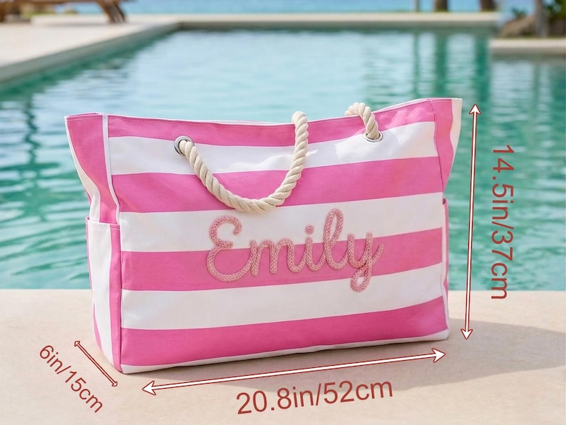 May include: A pink and white striped tote bag with the name "Emily" embroidered on the front. The bag has rope handles and side pockets. It measures 52cm long, 37cm high, and 15cm wide.