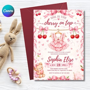 May include: A baby shower invitation card featuring a pink dress on a hanger, cherries, and a teddy bear. The text reads: She is the cherry on top, Please join us for a baby shower honoring Sophia Elise, Aug 23 2pm, The Berry Patch Cafe.