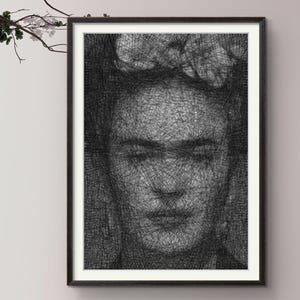 May include: A framed black and white string art portrait of a person with a floral headpiece. The image is created using a dense network of intersecting black threads against a light background, forming the facial features and hair details.