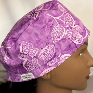 Beautiful purple surgery scrub hat with white leaves