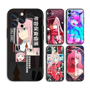 May include: Black phone cases featuring anime character art. The cases display images of a character with pink hair and green eyes. Text in Japanese is also visible on the cases. The cases are designed for various phone models.