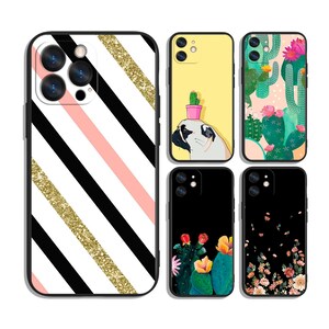 May include: A collection of phone cases with various designs. One case features black and white diagonal stripes with a gold glitter stripe and pink stripe. Other cases have cactus, floral, and pug designs.
