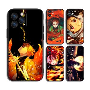 May include: A collection of black phone cases featuring anime characters. The cases display vibrant illustrations of characters in action poses, with fiery and electric visual effects. The designs include a variety of colors, including orange, yellow, and black.