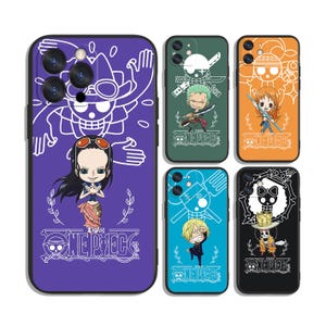 May include: A collection of phone cases featuring characters and symbols from the anime series "One Piece." Each case displays a different character or emblem against a solid color background, including purple, green, orange, blue, and black. The "One Piece" logo is visible on each case.
