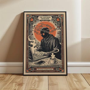 May include: Framed art print featuring a stylized illustration of a software developer. The image shows a person wearing a mask and working on a laptop, with a coffee cup and phone on the desk. The text "THE SOFTWARE DEVELOPER" is at the top.