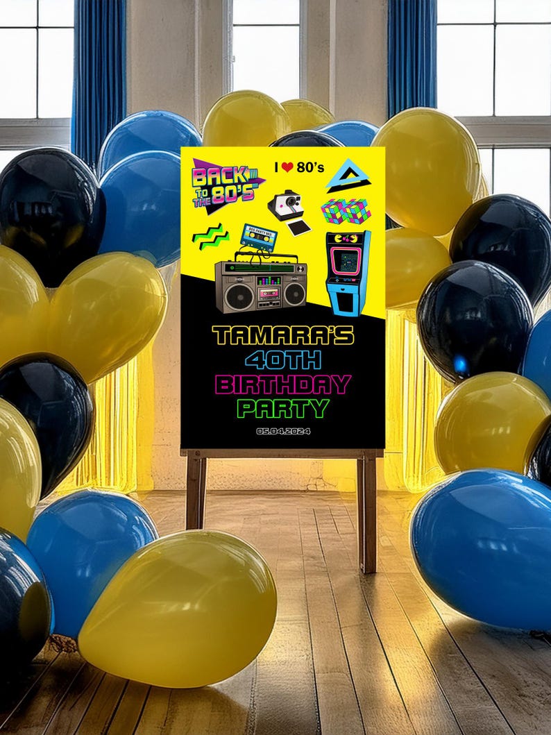 May include: A black chalkboard sign with a yellow and neon pink graphic design featuring a boombox, cassette tape, and a video game. The text on the sign reads "Back to the 80's", "I &hearts; 80's", "Tamara's 40th Birthday Party", and "09.04.2024". The sign is surrounded by yellow, blue, and black balloons.