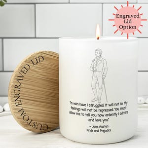 May include: White candle with a wooden lid, featuring a quote from Jane Austen's "Pride and Prejudice" and an illustration of a man. The lid is engraved with "Custom Engraved Lid".