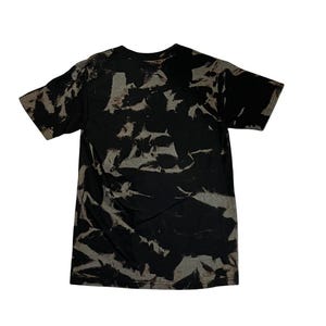 May include: Black t-shirt with a tie-dye pattern in shades of gray and black.