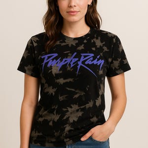 May include: A black tie-dye t-shirt with a purple "Purple Rain" graphic print.