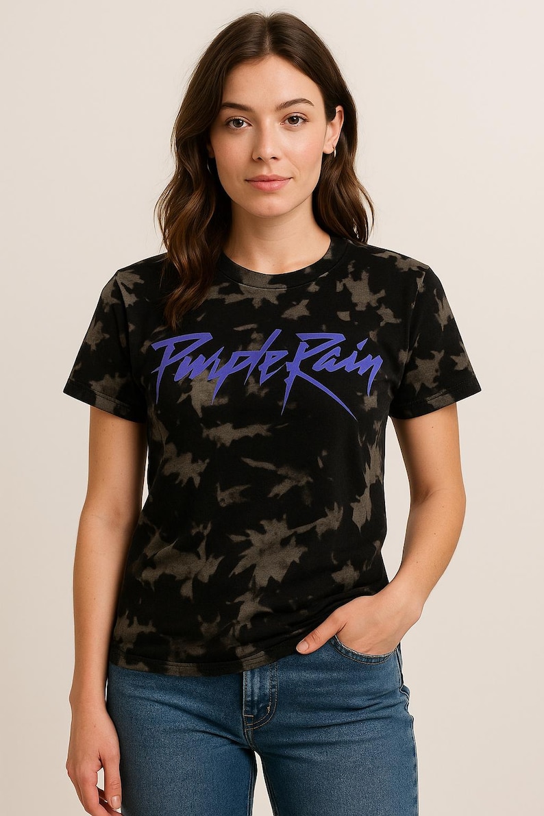 May include: A black tie-dye t-shirt with a purple "Purple Rain" graphic print.