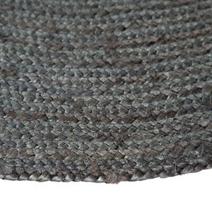 May include: A close-up of a round, gray jute rug with a woven texture.
