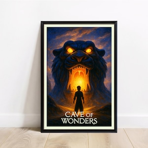 May include: Framed art print featuring a dramatic scene with a silhouetted figure standing before a large, roaring tiger-like structure with glowing eyes. The text "CAVE OF WONDERS" is displayed at the bottom. The artwork is set against a backdrop of a sunset.