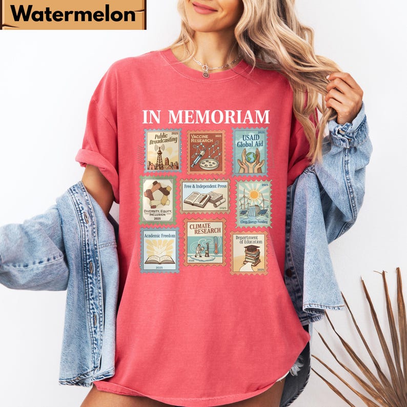 May include: A red t-shirt with the words "IN MEMORIAM" above a grid of nine postage stamp-like images. The stamps depict various themes, including "Public Broadcasting," "Vaccine Research," and "Climate Research."