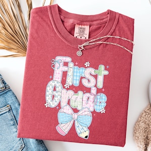 Comfort Colors® First Grade Teacher Shirt, Back to School 1st Grade Tee, Teacher Appreciation Gift, Cute Elementary School, Coquette Bow