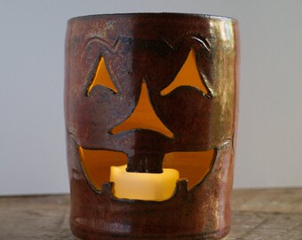 Copper-orange Jack-o-Lantern candle holder