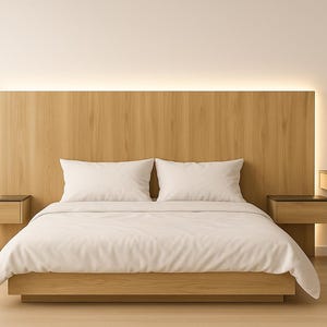 May include: A modern bedroom set featuring a wooden headboard with integrated lighting, two white pillows, and a bed with a white comforter. Two floating nightstands are on either side of the bed. The room has a minimalist design.