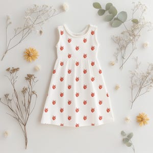 Dress design using strawberry clipart – repeating pink bow fruit motif