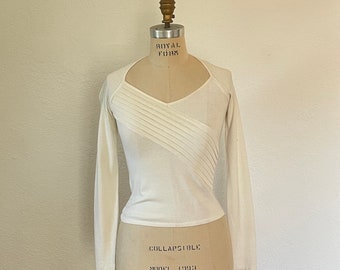 Minimal Creme Sweater Top by Armani Exchange long sleeve sweater top with geometric asymmetrical detail