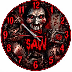May include: A circular wall clock featuring a graphic of the Saw movie character Billy the Puppet with red eyes and spiral cheeks. The design includes the text Live or Die and SAW, surrounded by metal traps, chains, and red blood-like splatters.