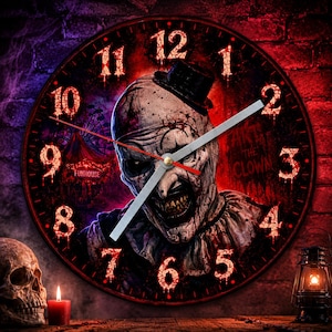 May include: A round wall clock featuring a graphic of a sinister clown with a top hat, blood-like splatters, and a funhouse background. The clock face displays red, dripping numbers from 1 to 12, silver hands, and the text Art the Clown.