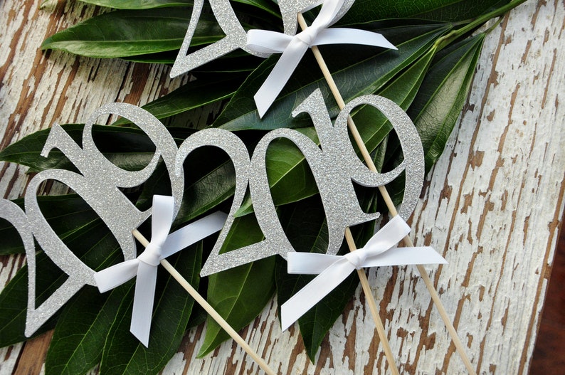 2019 Centerpiece. Graduation Centerpiece Silver 2019 Graduation Centerpiece Sticks with White Bows. 3 Single- 2019 Wands