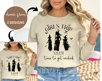 May include: Two designs for a beige sweatshirt with a black graphic of three witches and the text "Girls Trip Salem Massachusetts time to get wicked".