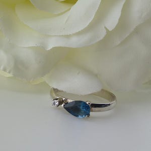 Natural Topaz and Zirconia ring on silver rhodium setting