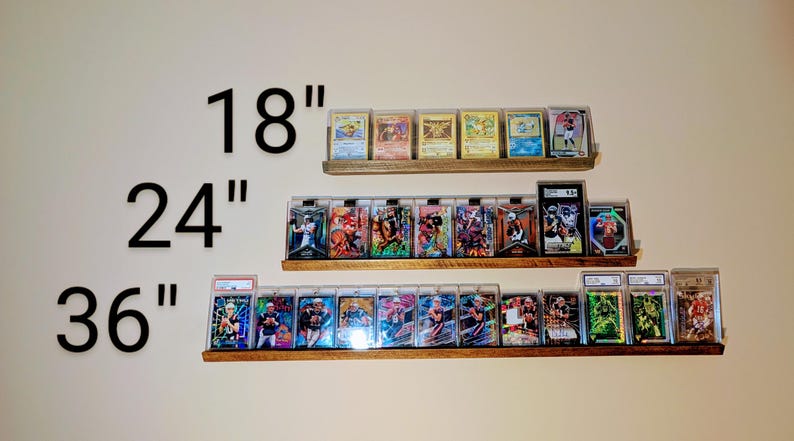 trading card displays in 18", 24" and 36" with sports cards, magic cards, and Pokemon cards mounted to the wall.