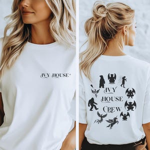 May include: White t-shirt with the text "IVY HOUSE" on the front and a circular design on the back. The back design features the text "IVY HOUSE CREW" surrounded by various black silhouette illustrations of mythical creatures.