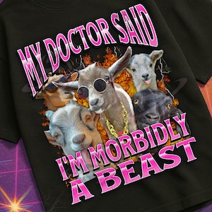 May include: Black t-shirt with a graphic featuring four goats wearing sunglasses and gold chains. The text "MY DOCTOR SAID I'M MORBIDLY A BEAST" is in pink. The shirt is part of the "Mildly Perturbed" collection.