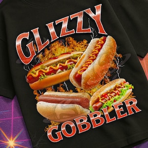 May include: Black t-shirt with a graphic of hot dogs and the words "GLIZZY GOBBLER" in a retro font. The shirt also features the text "MILDLY PERTURBED" and a VHS logo.
