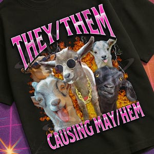 May include: Black t-shirt featuring a graphic of four goats wearing sunglasses and gold chains. The text "THEY/THEM CAUSING MAY/HEM" is in pink. The shirt is from the "Mildly Perturbed" collection.